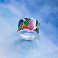 Sterling silver ring with hot cloisonne enamel. Handmade art work. GEORGIAN CLOISONNE ENAMEL MINANQARI Workshop of silver jewelry with a soul. Masters create works in the technique of hot cloisonne enamel.  Our workshop has been working for 5 years to create exclusive handmade jewelry. Here you can buy silver rings, earrings, pendants, made by best masters of sunny Georgia. This technology is already 1200 years old, and today our masters continue the ancient Georgian art of Minankari, combining modern trends and centuries-old history. We want to give you the opportunity to wear not just jewelry, but peace with character. Masters create jewelry from precious metals: silver and gold. In their work they use enamel of a deep and rich color, which has not lost the purity and brightness of color Georgian Art, Designer Silver Jewellery, Cloisonne Enamel, Enamel Bracelet, Enamel Ring, Enamel Jewelry, Silver Enamel, Art Jewelry, Rings Statement