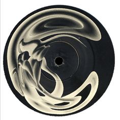 an artistic black and white object with swirls on it's side, against a white background