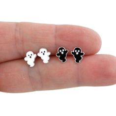 A darling pair of Ghost Earrings in sterling silver. Your choice of black or white ghost. They are made of sterling silver with colored enamel details The earrings measure 7mm x 8mm. They are great for those with sensitive ears. The backs of the earrings are also sterling silver. This listing is for one pair (2 pieces). Your earrings will ship in a gift box. Novelty White Pierced Jewelry, Novelty White Sterling Silver Jewelry, White Sterling Silver Novelty Jewelry, Spooky Silver Earrings For Gift, White Jewelry Gift, Spooky Hypoallergenic Jewelry For Halloween, Novelty Hypoallergenic Halloween Jewelry, Hypoallergenic White Jewelry For Halloween, Novelty Hypoallergenic White Jewelry