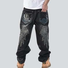 Take your look to the next level with our 2023 Autumn Collection of urban style. embroidered. mid-waist. loose denim pants with zipper & button closure. Crafted for comfort and crafted with style. these pants are the perfect blend of boldness and elegance that will make you stand out from the crowd!Distinctive Features: Street-Trend Design: Showcase your mode-setting trend with these edgy-style denim pants. Embroidered Detail: The intricate designs will add a unique touch to your look. Mid-Waist Embroidered Wide Leg Streetwear Pants, Embroidered Wide Leg Pants For Streetwear, Casual Embroidered Pants For Streetwear, Embroidered Straight Leg Jeans For Streetwear, Embroidered Relaxed Fit Bottoms For Streetwear, Embroidered Cotton Jeans For Streetwear, Baggy Embroidered Denim Jeans, Denim Pants Mens, Pants Baggy