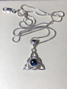 Did you enjoy Charmed, the TV show? I'll fabricate this sterling silver Celtic Trinity Knot pendant, approximately 1 inch in diameter, and I will set your choice of a 6mm round faceted or cabochon gemstone from the drop down menu. This comes with a 16 inch sterling silver box chain at 1.2mm thickness with a lobster claw for secure attachment. This is shown with a classic green Lab emerald faceted gemstone for the lucky lass in you! It's lovely, graceful and elegant...a timeless and classic tradi Spiritual Sterling Silver Birthstone Necklace With Gemstone, Spiritual Sterling Silver Necklace For May Birthstone, Silver Sterling Jewelry For May Birthstone, Sterling Silver Birthstone Necklaces For Healing, Spiritual Sterling Silver Jewelry For May Birthstone, Healing Sterling Silver Birthstone Necklace, Silver May Birthstone Round Pendant Jewelry, Silver May Birthstone Round Pendant, Silver Round Pendant For May Birthstone