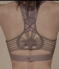 the back of a woman's bra with an intricate design