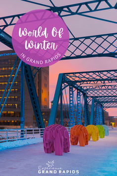 an image of colorful clothes on the ground in front of a bridge with words that read world of winter grand rapids