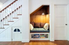 an image of a room with stairs and built - in bookshelves on it