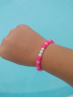 This bracelet is fun preppy and cute Casual Adjustable Pink Friendship Bracelets, Pink Bracelet Jewelry For Vacation, Casual Pink Friendship Bracelets, Cute Red Friendship Bracelets, Casual Pink Beaded Bracelets For Vacation, Fun Pink Beaded Bracelets For Vacation, Fun Pink Jewelry For Beach, Trendy Pink Jewelry For Vacation, Fun Pink Beach Jewelry