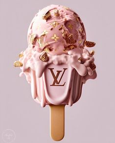 a pink ice cream with gold decorations on top