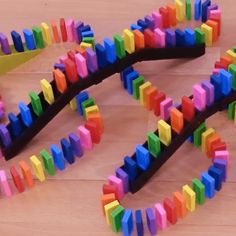 colorful wooden toys are laying on the floor and ready to be made into an art project