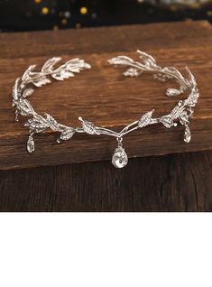 a bridal bracelet with leaves and crystal stones