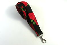 This cute lanyard has beautiful red roses on black. It is perfect for any occasion. You can leave me a convoy if you need a different size. You can have a wardrobe of lanyard to match your outfit. This lanyard is made of soft 100% cotton fabric to give a comfortable feel around your neck. This lanyard is easy to take care. You can spot clean and throw in a washer and hang dry. If you want you can iron and it is ready to use. These lanyards are perfect if you have metal allergy. Each of these lan Red Lanyard With Key Leash As Gift, Red Lanyards With Key Leash For Gifts, Keychain Fabric, Cute Lanyard, Fabric Keychain, Cute Lanyards, Patriotic Fabric, Fabric Lanyard, Beautiful Red Roses