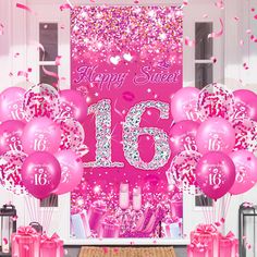 pink balloons and streamers in front of a happy sweet sixteen birthday sign with confetti