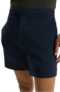 Cut from stretch-enhanced fabric, these shorts made with soft viscose feature a flat front and chino styling that keeps you looking smart at any occasion. 6" inseam; 23" leg opening; 10 3/4" front rise; 15 1/2" back rise Front slant pockets; back welt pockets 64% viscose, 30% nylon, 6% elastane Machine wash, dry flat Imported Cotton Shorts For Business Casual, Business Casual Bermuda Cotton Shorts, Business Casual Cotton Shorts With Short Legs, Classic Solid Color Shorts For Business Casual, Classic Solid Shorts For Business Casual, Modern Bottoms With Built-in Shorts, Business Casual Summer Shorts With Welt Pockets, Business Casual Shorts With Welt Pockets For Summer, Classic Navy Summer Bottoms