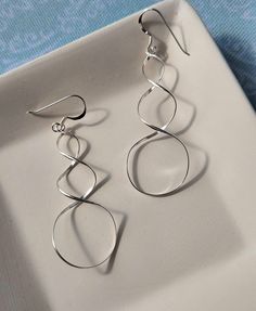 Airy, bright, reflective, and open - The Flow State Earrings are unique enough to make a statement yet subtle enough for casual wear. - Crafted of sterling silver- Earrings are 1.75" long and 3/4" wide. Nickel-free Dangle Earrings With A Modern Twist, Unique Nickel-free Dangle Hoop Earrings, Unique Nickel-free Dangle Flower Earrings, Minimalist Sterling Silver Nickel-free Linear Earrings, Artistic Nickel-free Drop Earrings, Perfume Jewelry, Flow State, Clean Sterling Silver, Deco Jewelry