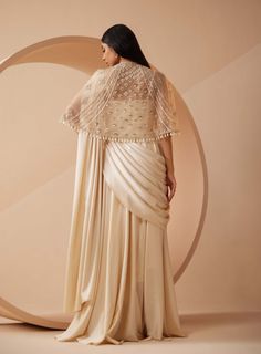 Roqa | Estella Off-White Drape Sari And Cape | INDIASPOPUP.COM Saree With Jacket, Drape Sari, Gown Saree, Off White Saree, Cutdana Embroidery, Saree Gowns, Pleated Saree, Sequin Cape, Embroidered Cape