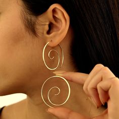 Introducing our stunning Large Spiral Earrings, a mesmerizing blend of bold design and elegant sophistication.  Orders; It is carefully produced by NisPersonalized. "MATERIAL"   -- 100% 925k Sterling Silver - This solid, precious metal is a classic that lasts forever. While it may darken over time, with continuous care and an occasional, it's as good as new. -- 18K Gold Plated - For those with an eye for striking gold, our gold jewelry uses sterling silver as a base and is plated with a durable Gold Round Earrings, Spiral Earrings, Rose Gold Jewelry, Bold Design, Precious Metal, Jewelry Earrings Hoops, Round Earrings, Silver Hoops, Silver Hoop Earrings