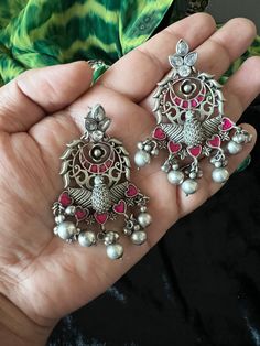 Handcrafted in Brass and stones with antique polish. Premium Quality Pick them up and make a stunning statement. Length: 7 cms Width : 4.3 cms Push back closure Weight: 36 grams (pair) Elegant Antique Finish Earrings For Festive Occasions, Elegant Oxidized Finish Chandbalis As A Gift, Vintage Metal Chandbali Danglers, Antique Finish Drop Earrings For Wedding, Elegant Oxidized Chandbalis As Gift, Elegant Gift Chandbalis With Oxidized Finish, Elegant Chandbalis With Oxidized Finish As Gift, Oxidized Metal Temple Jewelry Earrings, Antique Finish Chandbali Earrings As Gift