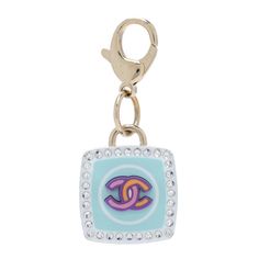 This is an authentic CHANEL Metal Resin Crystal CC Key Ring Bag Charm in Gold and Multicolor. This lovely blue enameled charm features a gold CC logo in the middle and gold around the edges, affixed to a CC engraved lobster clasp. Jewelry Accessories Ideas, Ring Bag, Accessories Ideas, Handbag Wallet, Cc Logo, Wallet Accessories, Bago, In The Middle, Key Ring