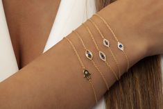 This 14k sapphire and diamond evil eye bracelet is a symbol of protection. Perfect for layering or to gift someone special. __________________________________________M A T E R I A L & L E N G T HAvailable in 14k Yellow Gold, 14k Rose Gold, 14k White GoldStone: Natural DiamondBracelet length: 6+1 inches (Please let us know if you prefer a different length)-- SMALL --Charm Size: 8x5 mmPrimary Stone: .06 Diamond | .07 Blue SapphireNumber of stones: 12 Diamonds | 1 Blue Sapphire-- LARGE --Charm Size Elegant 14k Gold Evil Eye Bracelet Gift, Elegant Evil Eye Bracelet With Diamonds As Gift, Elegant Beaded Evil Eye Bracelet, Elegant Evil Eye Bracelet For Everyday, Elegant Everyday Evil Eye Bracelet, Elegant Evil Eye Bracelets As A Gift, Diamond Evil Eye Bracelet, Symbol Of Protection, Diamond Evil Eye