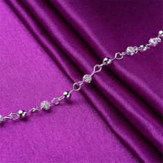 Show off your pedicure and add touch of light-catching shine to your ensemble with this elegant anklet plated in gleaming sterling silver. 0.27'' W x 9.84'' L S-hook clasp Fine silver-plated copper Elegant Anklet, Leg Jewelry, Hand Chain Jewelry, Leg Chain, Silver Anklet, Employee Benefits, S Hook, Beaded Anklets, Silver Anklets