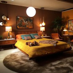 a bed room with a neatly made bed and two lamps