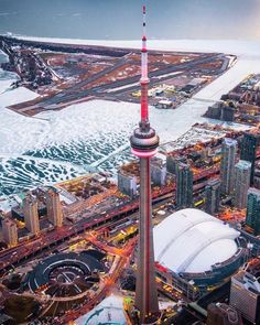 an aerial view of the city and water