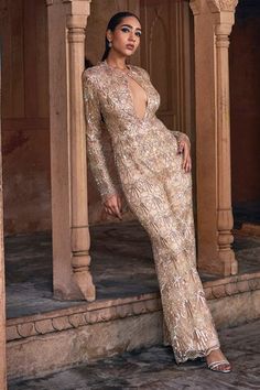 Champagne gold jumpsuit with all over embellishments in quatrefoil pattern using crystals, sequins, beads and cutdana work. - Aza Fashions Crystal Jumpsuit, Cutdana Work, Gold Jumpsuit, Using Crystals, Embellished Jumpsuit, Quatrefoil Pattern, Full Sleeves, Champagne Gold, Aza Fashion