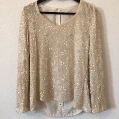 Attn Vintage Lovers! Cream Sequin Top! In Great Condition! V Neckline With Beading Around The Neckline. Long Sleeve With Scallop Beading Hemline. Zipper Works Great And A Hook At The Top For Better Support. Never Worn By Me. No Stains But A Few Snags Shown In Pictures. However, Considering It’s A Vintage Sequin Top It’s Really In Great Condition With The Great Detailing It Has. It Is Not Lightweight Because Of All The Beading In The Front And Back. Does Not Provide A Size But Dimensions Are Show Elegant Celebration Blouse With Sequins, Elegant Embellished Holiday Blouse, Elegant Beaded Blouse For Party, Elegant Beaded Blouse For Formal Occasions, Elegant Embellished Blouse For Celebration, Elegant Beaded Blouse For Wedding, Elegant Sparkling Tops For Festive Occasions, Elegant Formal Blouse With Beaded Details, Glamorous Beaded Tops For Wedding