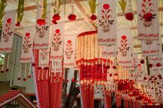 red and white decorations hanging from the ceiling