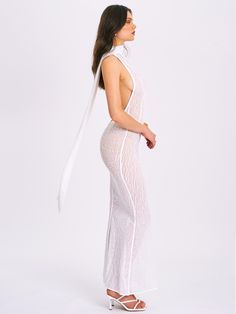 Introducing the Olena, a captivating White Burnout Velvet Animal Print Mesh Halter Neck Maxi Dress perfect for summer. This dress features a halter neck design, an alluring open back with button closures, and intricate burnout velvet detailing. The flowing maxi mermaid silhouette enhances your natural curves, while the high-stretch fabric ensures comfort and a sleek look. Ideal for beachside parties, sunset dinners, or any special occasion, the Olena dress will make you the center of attention. Satin Corset Dress, Jumpsuit And Blazer, Halter Neck Maxi Dress, Burnout Velvet, Bubble Dress, Mermaid Silhouette, Trendy Prints, Satin Gown, Halter Maxi Dresses