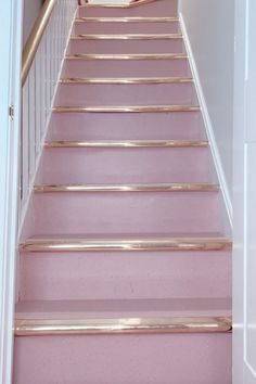 the stairs are painted pink and gold