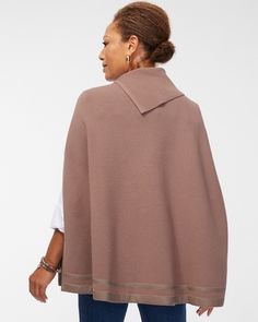 The Faux Leather Trim Sweater Cape has one-of-a-kind seasonal style. This knit design features tonal faux leather trim detail, plus a chic envelop neckline. Wear it when the weather cools down paired with pants and turtlenecks. Made from knit fabric. Classic fit 3/4 sleeve envelope neck sweater cape. Length: XXS/XS: 27.5" S/M: 28.5" L/XL: 29.5" . 65% rayon, 25% polyester, 10% modal. Machine wash. Imported. | Women's Faux Leather Trim Sweater Cape in Brown size XXS/XS | Chico's Sweater Cape, Cape Sweater, Mark Price, Womens Designer Fashion, Sweaters And Jeans, 5 S, Pants Jeans, Trim Detail, Seasonal Fashion