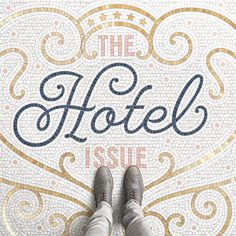 a person standing in front of a mosaic floor with the words hotel issue written on it