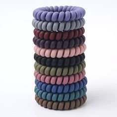 Non-marking Spiral/Coil Hair Ties Matte Multi-color pack (11 big hair ties in a pack) Material: Plastic Which hair type is it good for?✔ Straight✔ Wavy✔ Curly✔ Coiled✔ Tightly Coiled Suggested Usage: -Wrap around your hair two to three times, as desired.-For big pineapples and voluminous pineapples, only wrap once. 𝐂𝐮𝐫𝐥 𝐂𝐨𝐢𝐥𝐬 help to prevent tangling and hair breakage that many hair ties cause. The spiral, telephone cord design spreads the pressure of the hair elastic out over a greater Coil Hair Ties, Matte Hair, Coiled Rope, Hair Coils, Hair Supplies, Hair Accessories Collection, Elastic Hair Ties, Spiral Design, Hair Rings