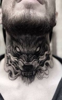 a man with a neck tattoo that has a wolf head on the top of it