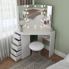 a white vanity with lights on it in a bedroom next to a bed and window