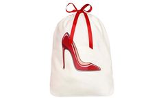 a white bag with a red high heel shoe on it