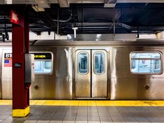 an empty subway car with its doors open