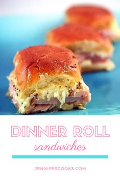 two ham and cheese sandwiches on a blue plate with the title text dinner roll sandwiches