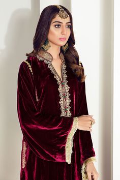 Maroon velvet shirt with embellished ban and embroidery on neck. Comes with plain pants and chiffon dupatta. Neck Designs For Velvet Suits, Elegant Salwar Kameez With Embroidered Border, Elegant Velvet Dupatta With Mirror Work, Elegant Velvet Dupatta, Elegant Velvet Kurta For Formal Occasions, Festive Velvet Kurta, Velvet Dupatta With Mirror Work, Elegant Velvet Kurta With Resham Embroidery, Elegant Formal Salwar Kameez With Embroidered Border