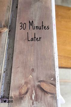 an old wooden plank with the words 30 minutes later written on it in black ink