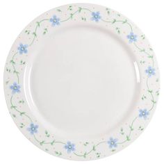 a white plate with blue flowers and green leaves on the rim, against a white background