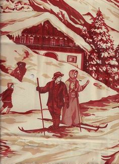 an image of two people on skis in front of a house with snow covered mountains