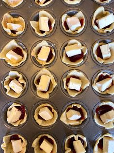 cupcakes with butter and jam in muffin tins ready to go into the oven