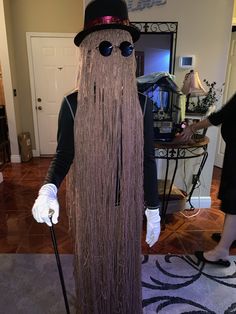 a man dressed up as a wizard with long hair