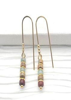 Made with 14k gold-filled wire and Aqua Terra Jasper beads. Handmade in small batches in the United States. These earrings measure approximately 1.5" in diameter. Details: Diameter: 1.5" Weight: 0.2 oz (5.67 g) Dimensions: 2.5 x 2.5 x 0.3 in (6.4 x 6.4 x 0.6 cm) Earring Packaging, Gold Beaded Earrings, Gold Bead Earrings, Aqua Terra, Crafts Jewelry, Earring Cards, Beads Handmade, Diy Crafts Jewelry, Jasper Beads