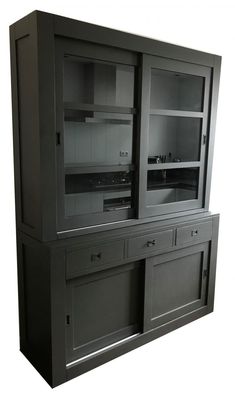 a large black cabinet with two doors and drawers on the front, one door open