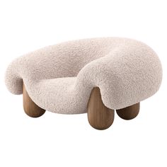 a white chair with wooden legs and an oval shaped cushion on the seat, it's made out of sheep fur