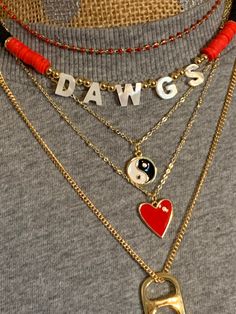 Perfect Gameday necklace that is full of detail, the beads are recycled heishi beads with perfect pops of red and black colors. The letters are mother of pearl with amazing detail, if you have any questions please email me Georgia Bulldog, Bottle Cap Necklace, Gold Pendent, Water Pearl Necklace, Pink Charm, Sugar Land, Initial Name, Horn Necklace, Necklace Initial