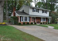 a house with a driveway in front of it