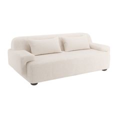 a white couch with pillows on it