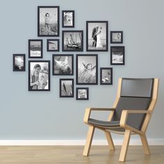 a chair sitting in front of a wall with pictures on it